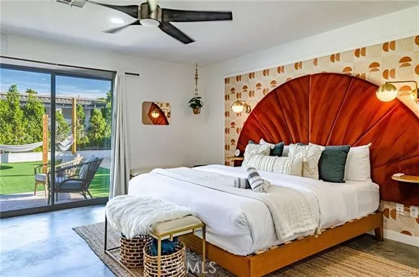 a bedroom with a bed and window
