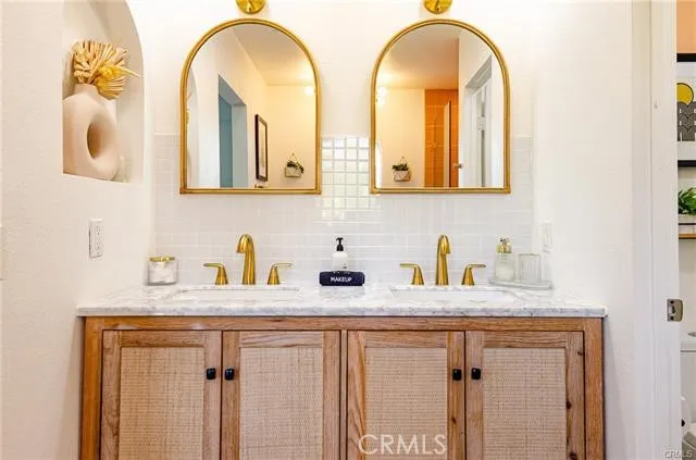 a building outdoor space with patio furniture and garden