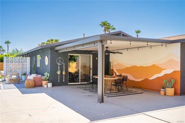 2770 East Ventura Road Palm Springs, CA 92262 - Photo 21 of 27 a view of a patio with couches table and chairs and potted plants