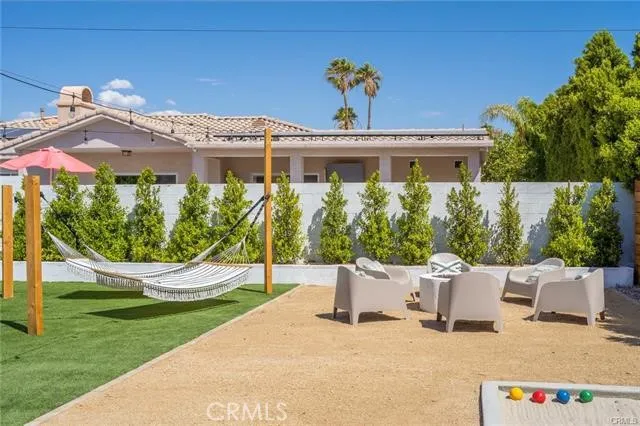 a view of a couches in patio and a yard