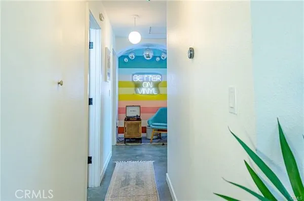 a view of a bedroom from a hallway