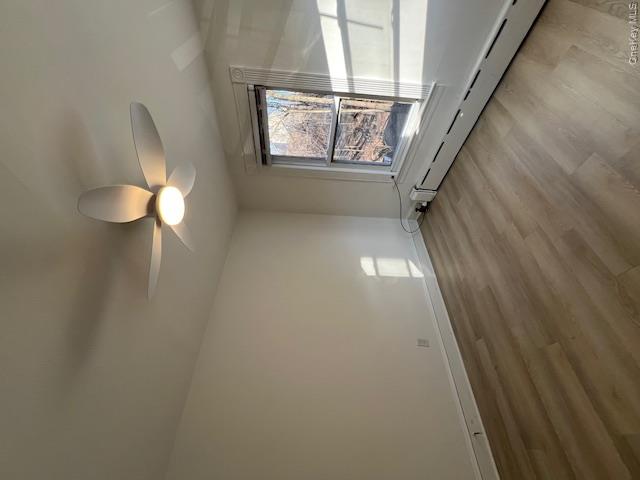 418 Christian Herald Road, Unit 4 Valley Cottage, NY 10989 - Photo 14 of 16 wooden floor in an empty room with a window