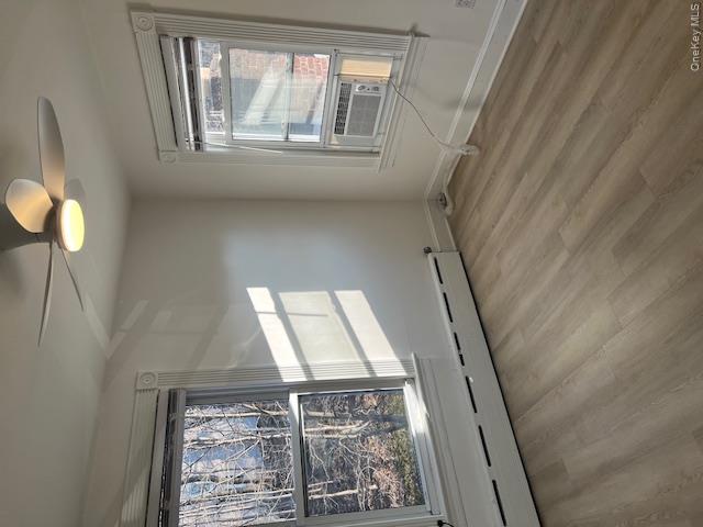 418 Christian Herald Road, Unit 4 Valley Cottage, NY 10989 - Photo 15 of 16 an empty room with wooden floor and windows