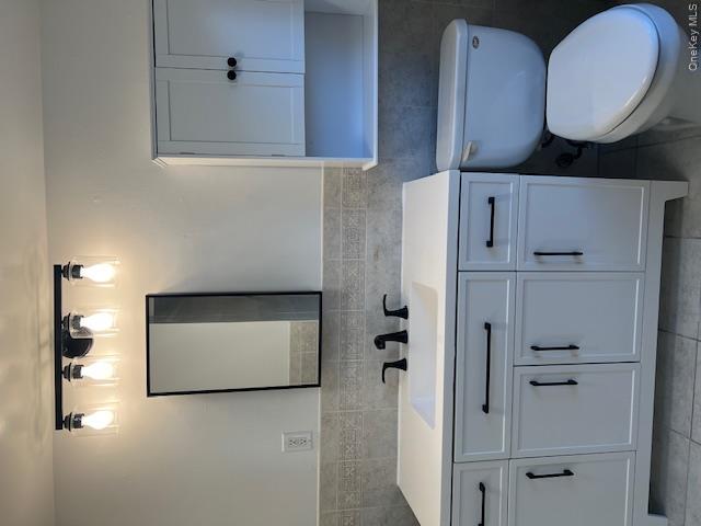 418 Christian Herald Road, Unit 4 Valley Cottage, NY 10989 - Photo 8 of 16 a bathroom with a toilet sink and mirror
