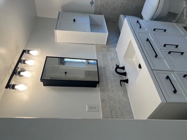 418 Christian Herald Road, Unit 4 Valley Cottage, NY 10989 - Photo 10 of 16 a bathroom with a sink vanity and mirror