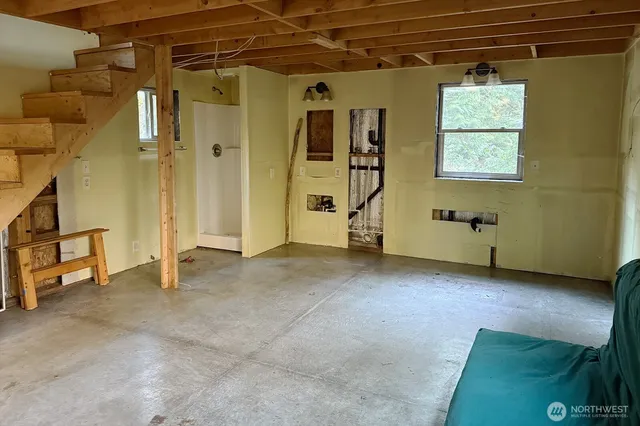 a view of an empty room with a window