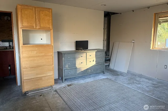 wooden floor in an empty room and a window
