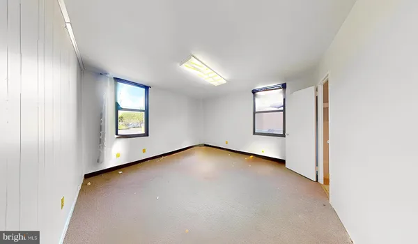 a view of a hallway with wooden shelves