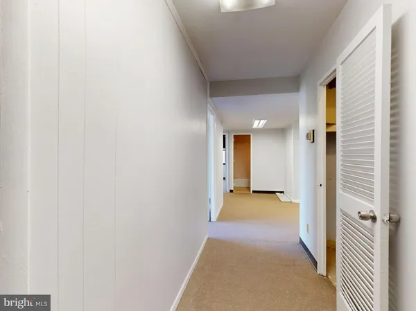 a view of a hallway with windows