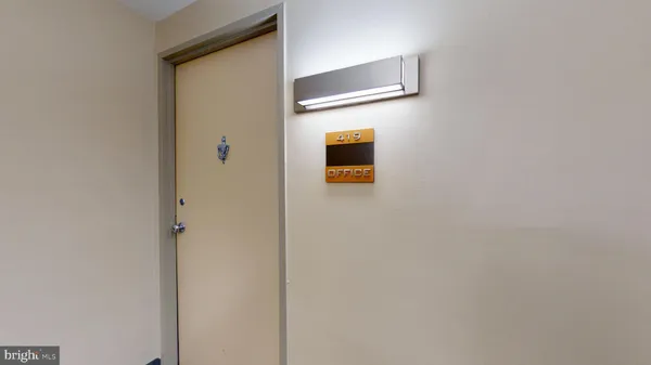 a dining room with furniture and a book shelf