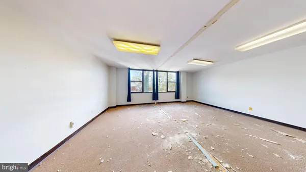 a building outdoor space with patio furniture and potted plants