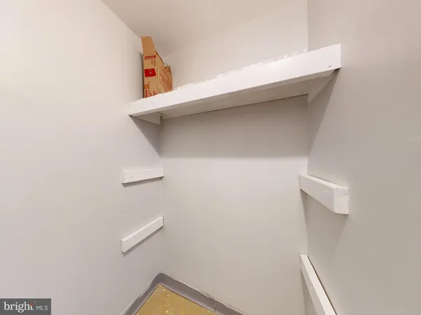 a view of a road with porch and bench