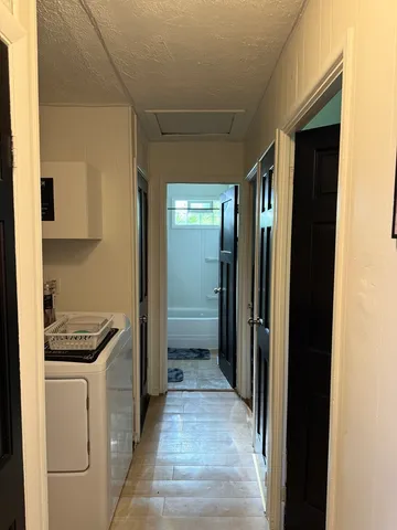 a kitchen with a refrigerator and cabinets