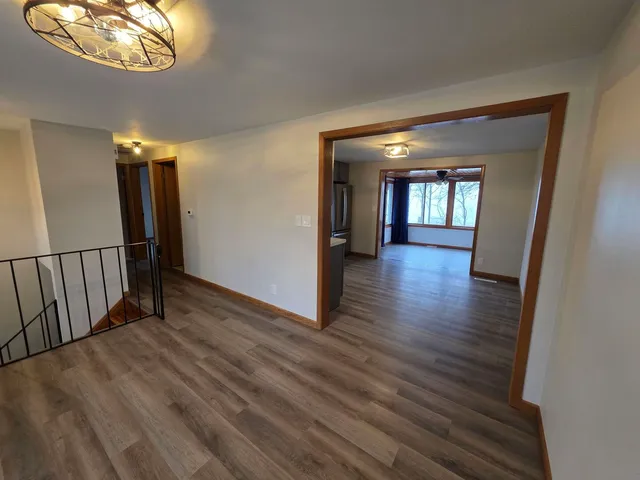 wooden floor in a hall with an entryway