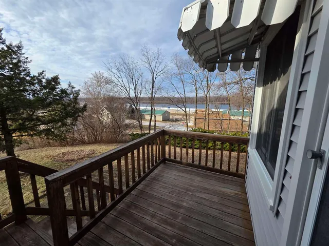 a view of balcony with wooden floor