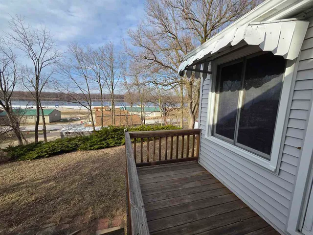 a view of a wooden deck with a bench