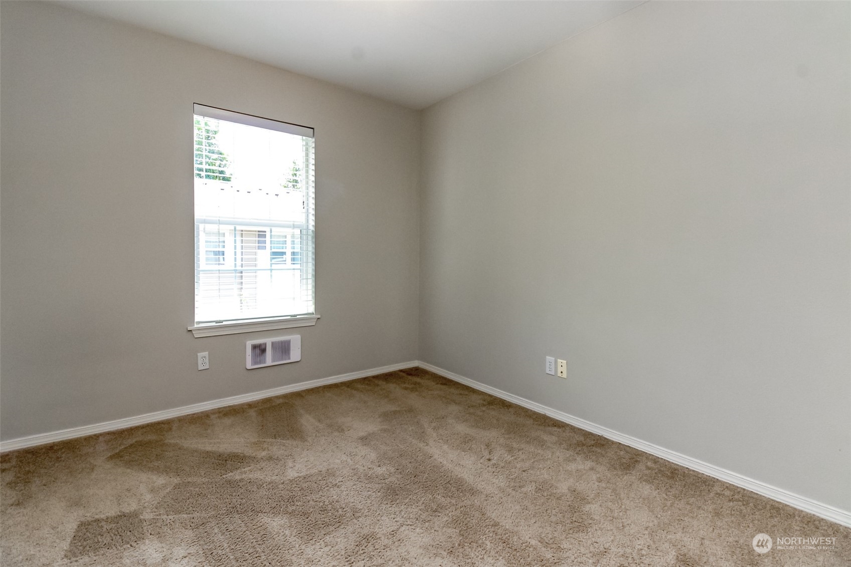 1607 Kincaid Street, Unit E8 DuPont, WA 98327 - Photo 17 of 28 an empty room with a window