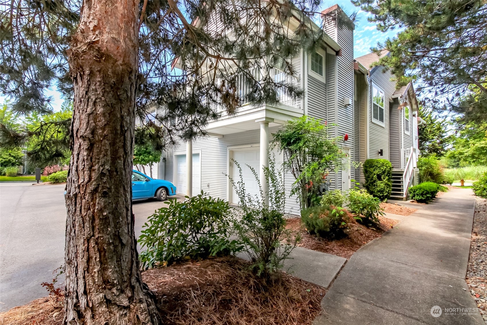 1607 Kincaid Street, Unit E8 DuPont, WA 98327 - Photo 2 of 28 a house view with a outdoor space