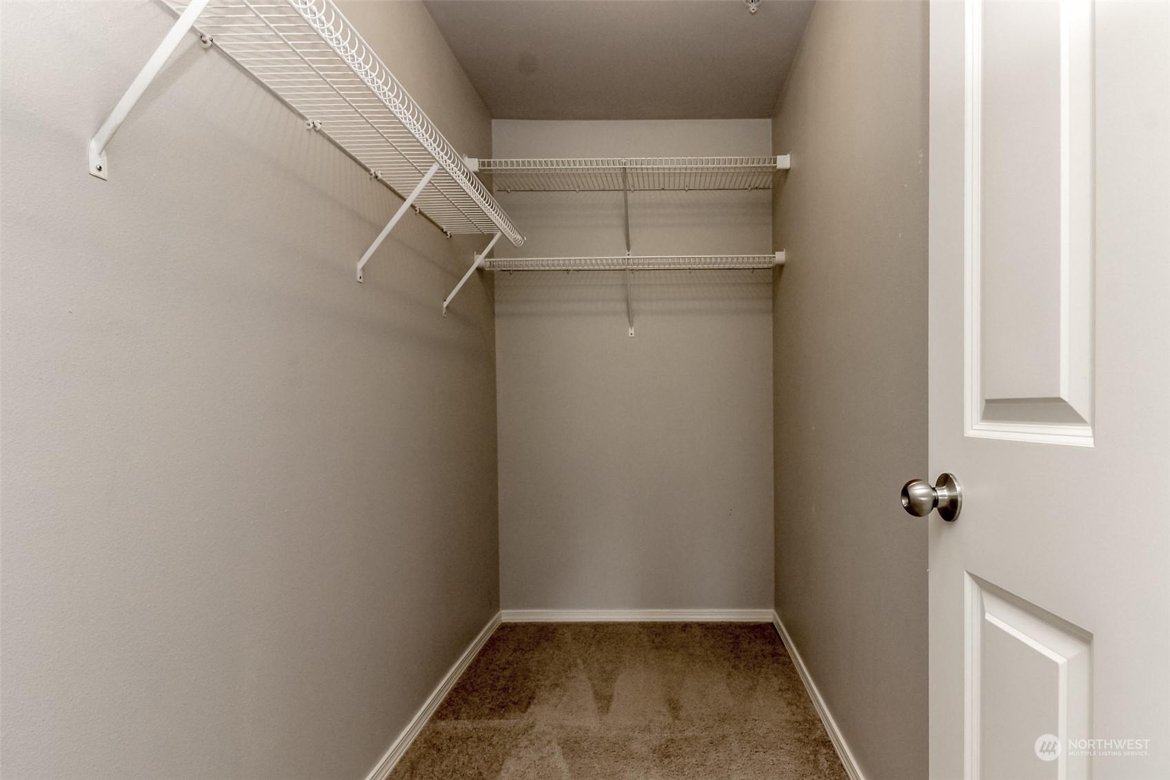 1607 Kincaid Street, Unit E8 DuPont, WA 98327 - Photo 23 of 28 a view of a room with rack on the wall