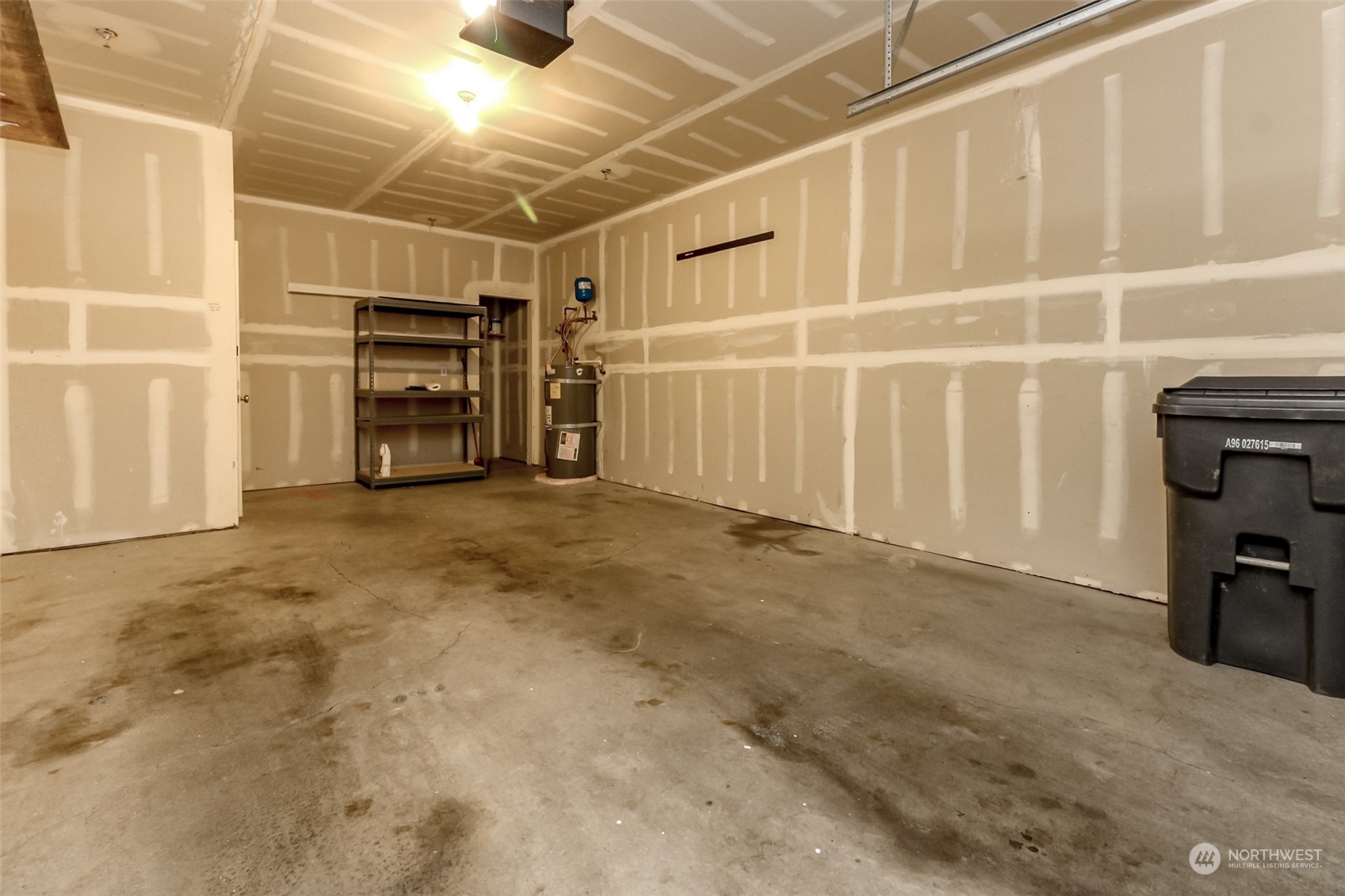 1607 Kincaid Street, Unit E8 DuPont, WA 98327 - Photo 25 of 28 a view of an empty room with a staircase