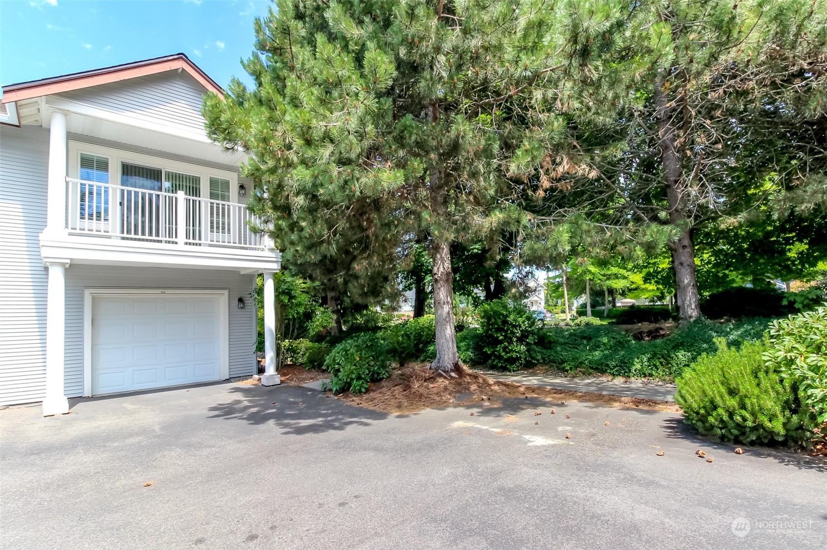 1607 Kincaid Street, Unit E8 DuPont, WA 98327 - Photo 28 of 28 a front view of a house with a garden