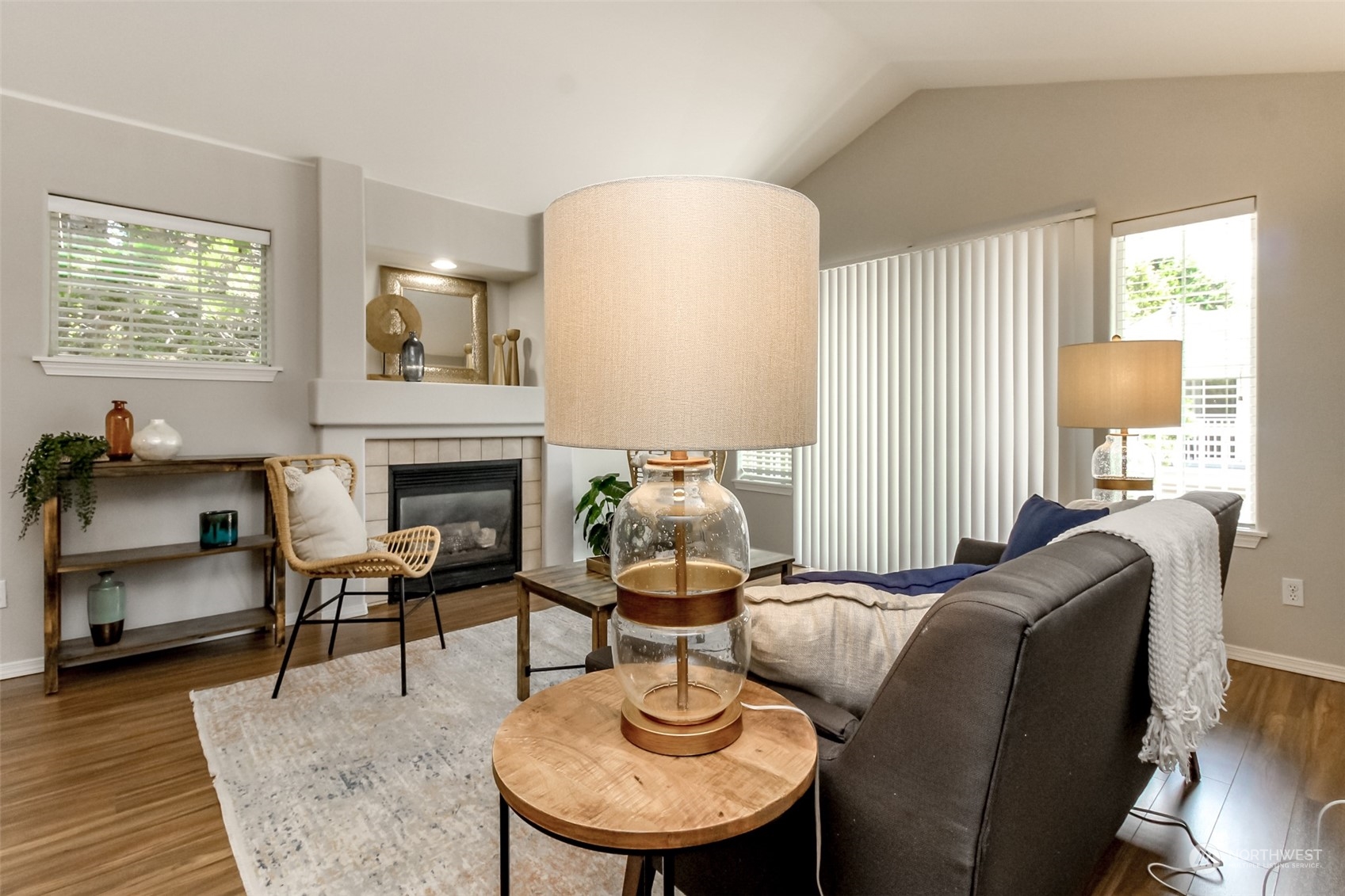 1607 Kincaid Street, Unit E8 DuPont, WA 98327 - Photo 8 of 28 a living room with furniture a window and a fireplace
