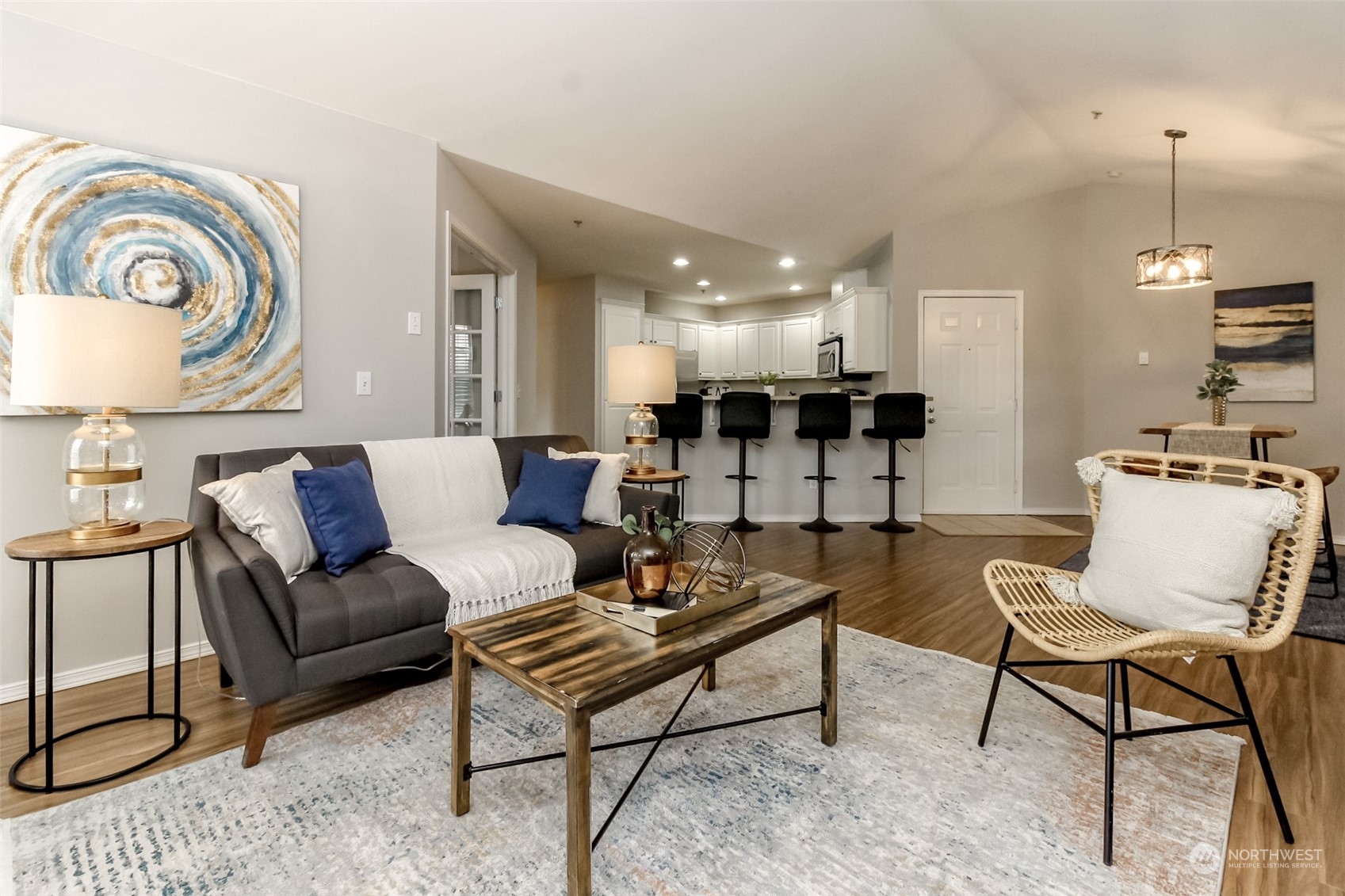 1607 Kincaid Street, Unit E8 DuPont, WA 98327 - Photo 9 of 28 a living room with furniture and a wooden floor