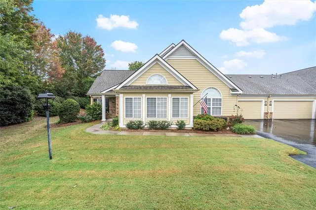 a front view of a house with a yard