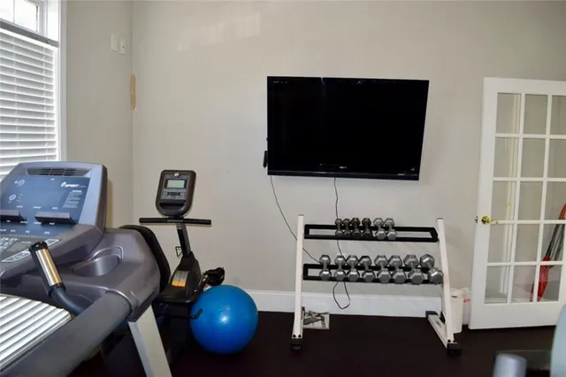 a living room with furniture or window and a book shelf