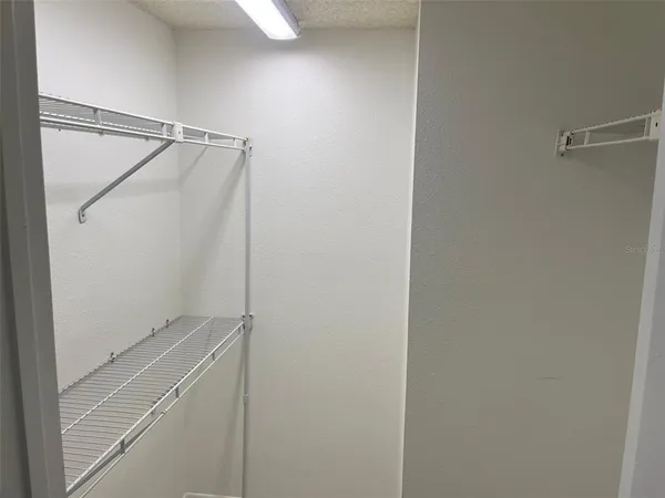 a view of a room with racks on the wall