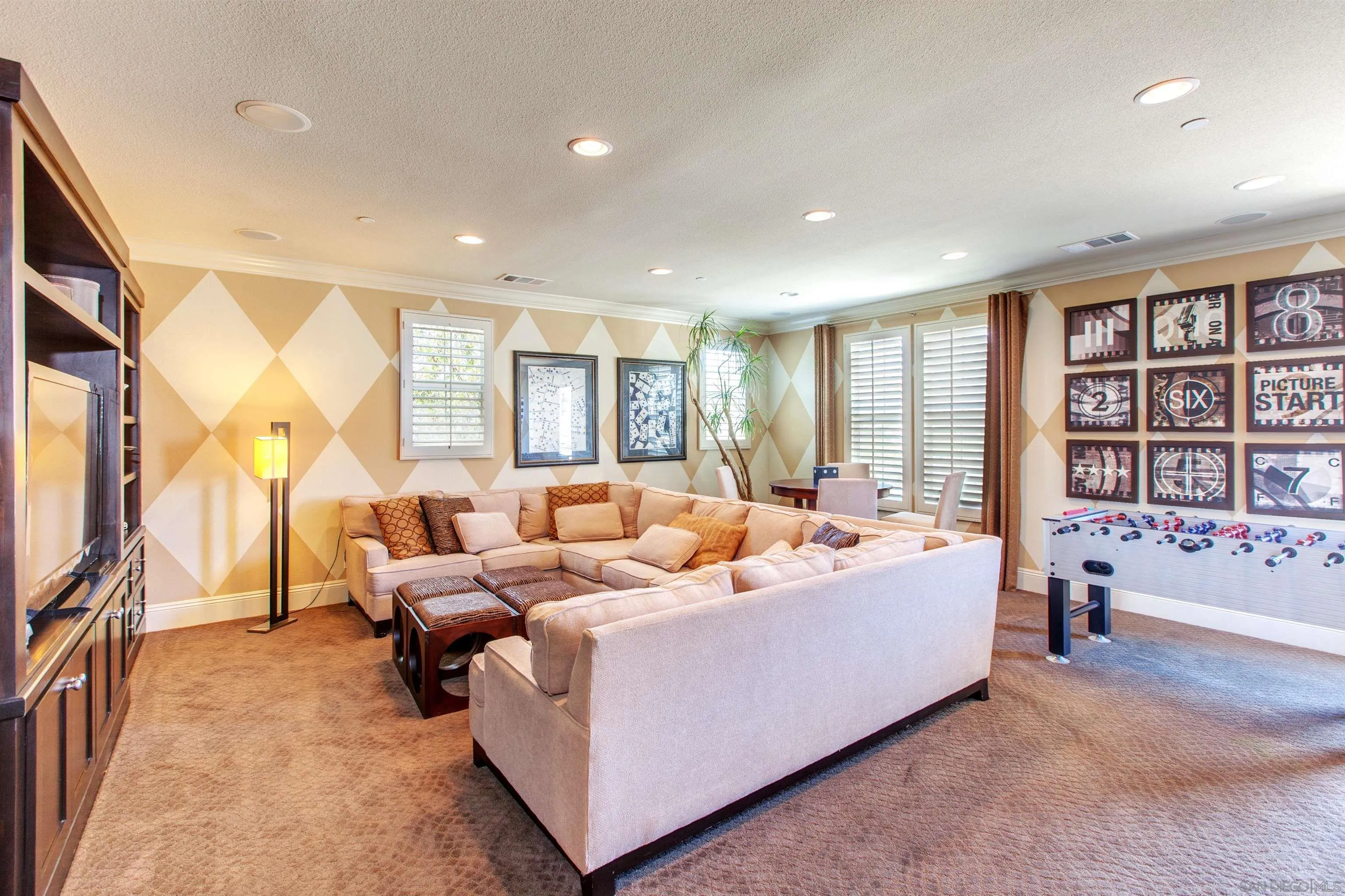 671 Via Maggiore Chula Vista, CA 91914 - Photo 26 of 42 a living room with furniture and a flat screen tv