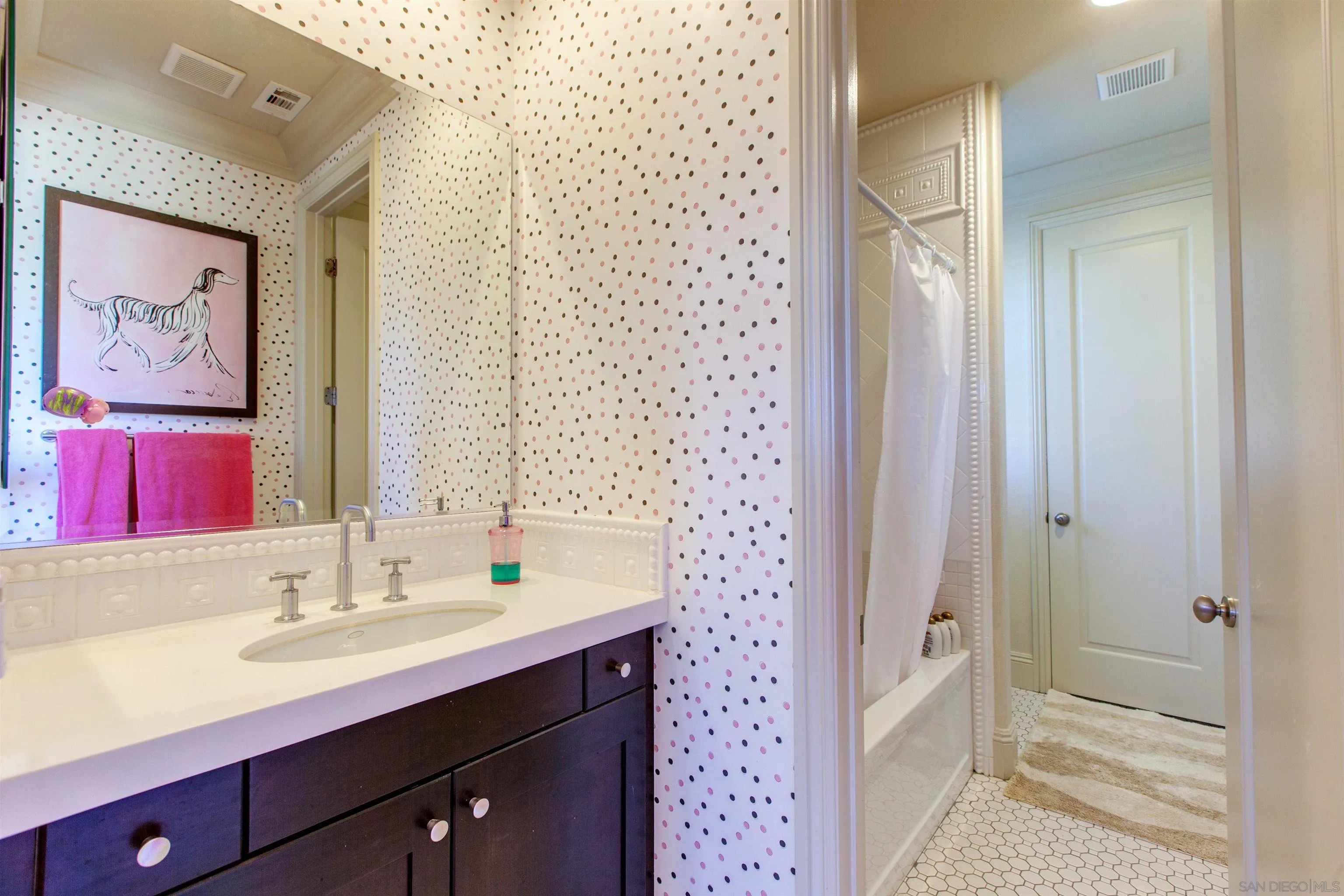 671 Via Maggiore Chula Vista, CA 91914 - Photo 29 of 42 a bathroom with a double vanity sink mirror and double