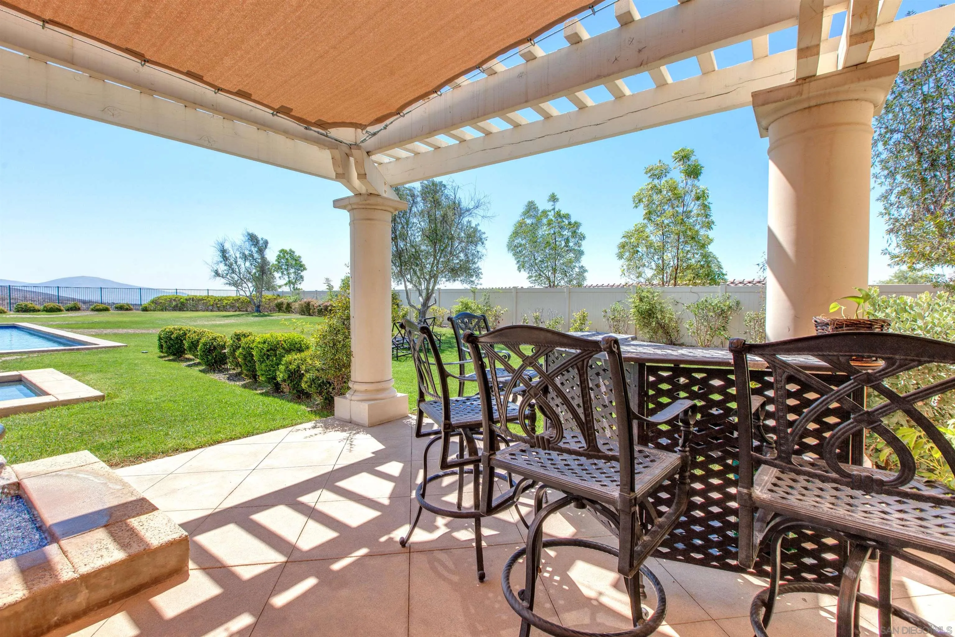 671 Via Maggiore Chula Vista, CA 91914 - Photo 34 of 42 a view of a patio with table and chairs and potted plants