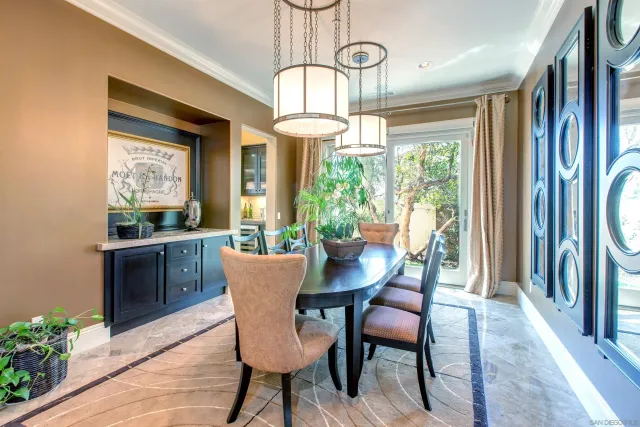 a view of entryway and hall with dining room