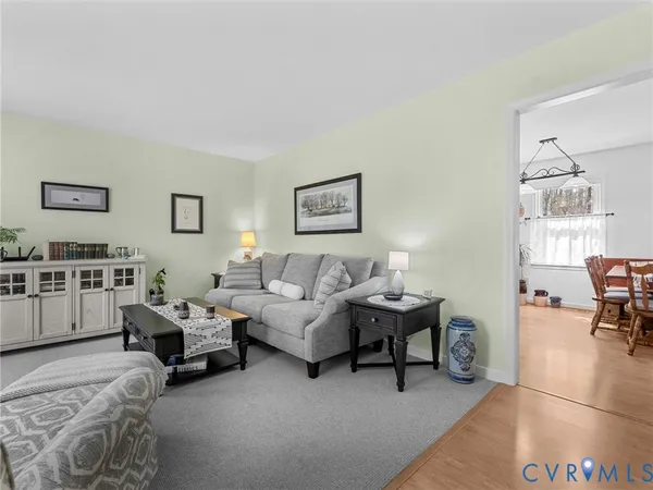 a living room with furniture and a area