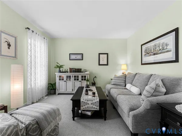 a living room with furniture and a couch