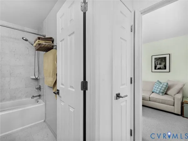 a bathroom with a sink a toilet a mirror a vanity and shower