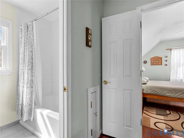 a bathroom with a sink a toilet and a window