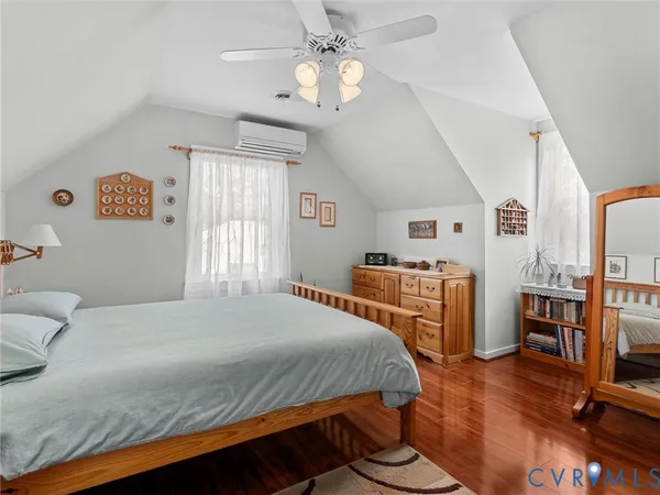 a bedroom with a bed and a table in it