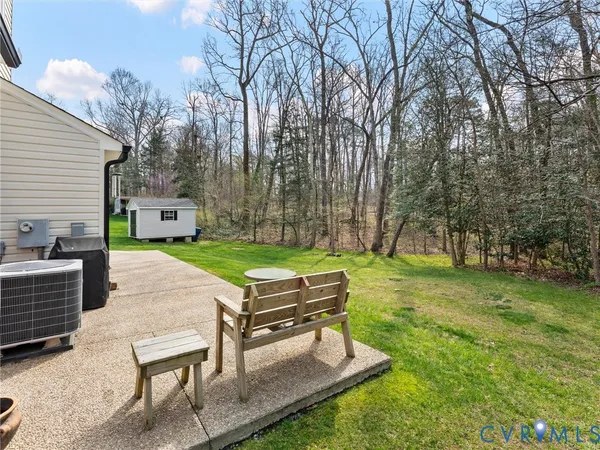 aerial view of a house with a yard deck and a slide