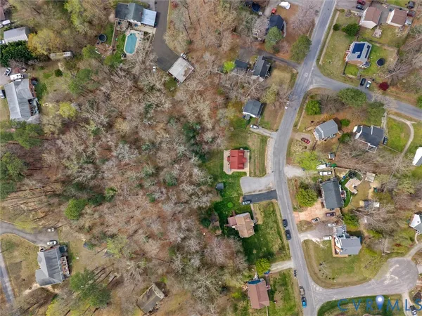 an aerial view of residential house with outdoor space and swimming pool