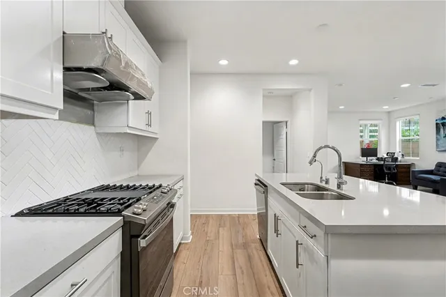 a bedroom with a bed and a tv