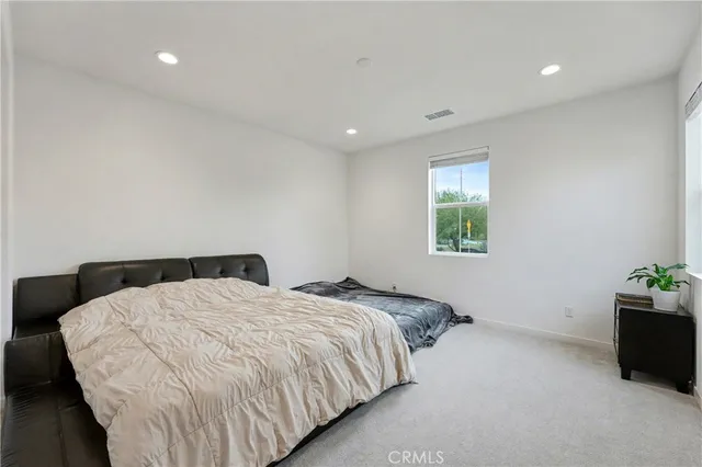 a bedroom with a bed and closet