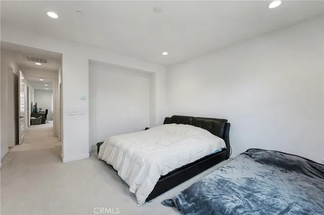 a bathroom with double sink and a mirror