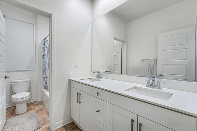 a utility room with dryer and stove