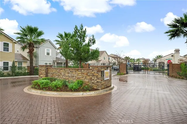 a view of a brick house with a yard