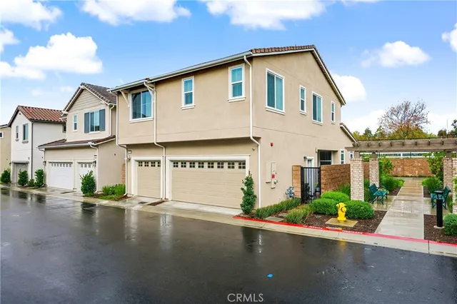 a front view of a house with a street
