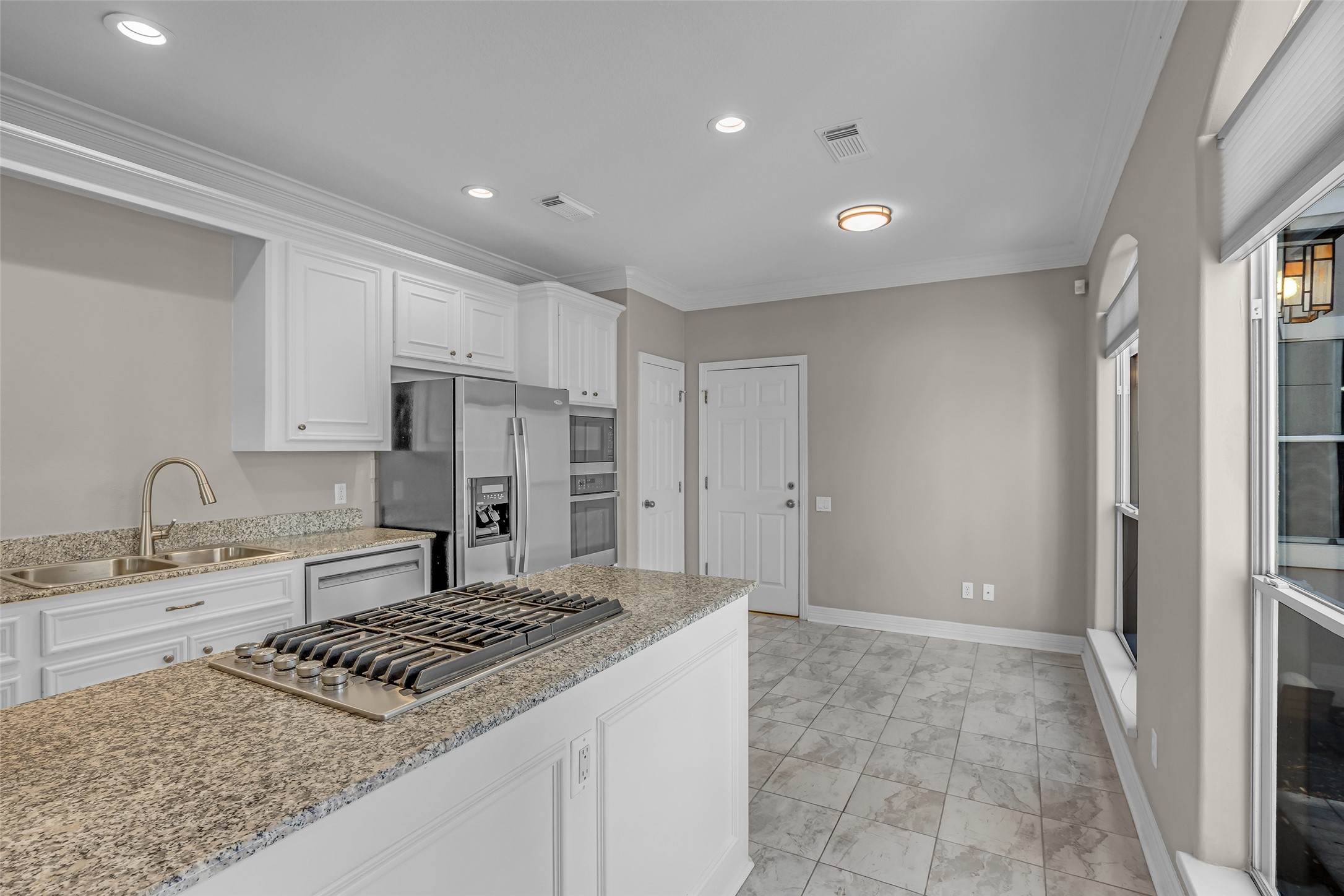 4916 Travis Street Houston, TX 77004 - Photo 11 of 27 a kitchen with a sink stove and refrigerator