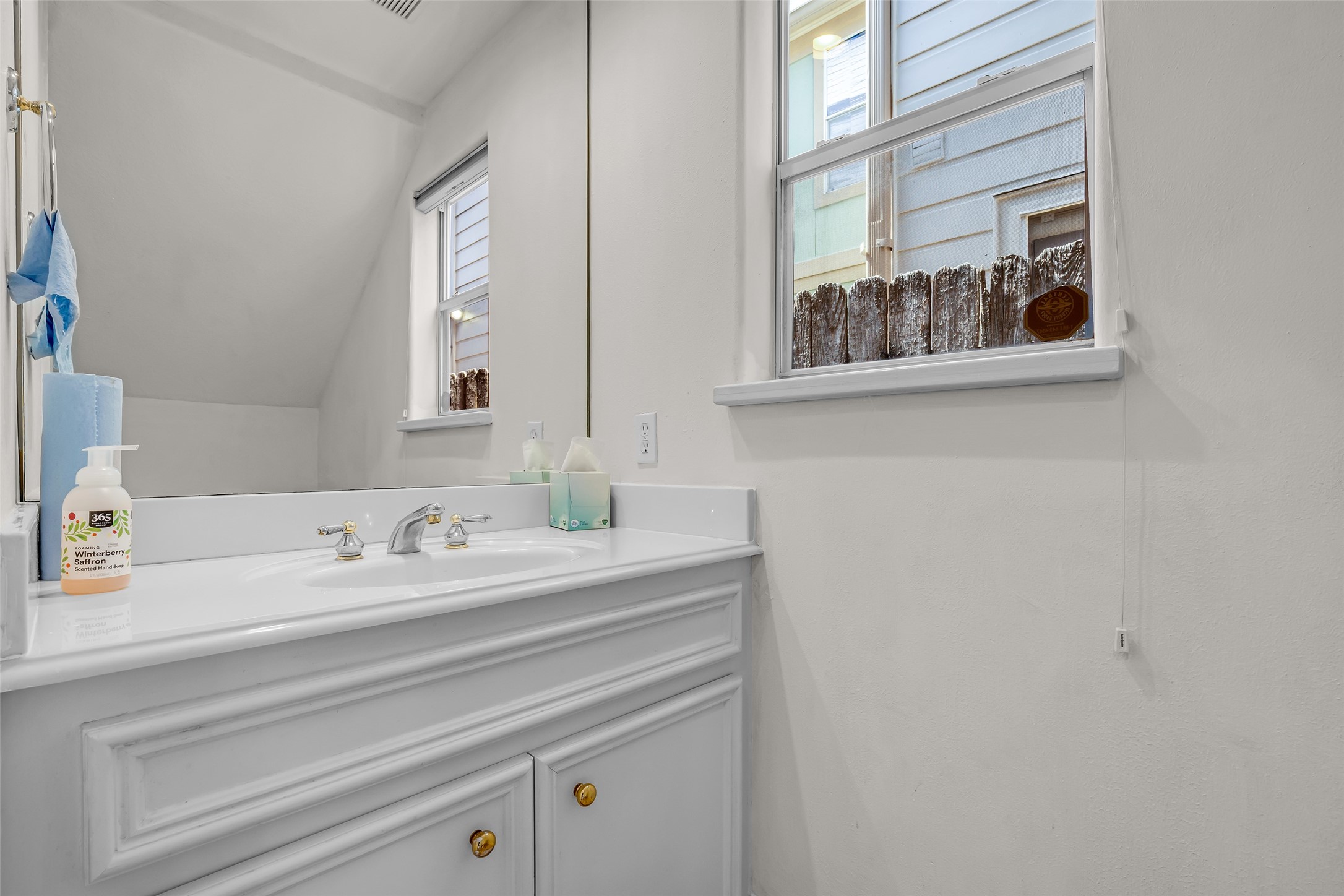 4916 Travis Street Houston, TX 77004 - Photo 13 of 27 a bathroom with a sink and a mirror