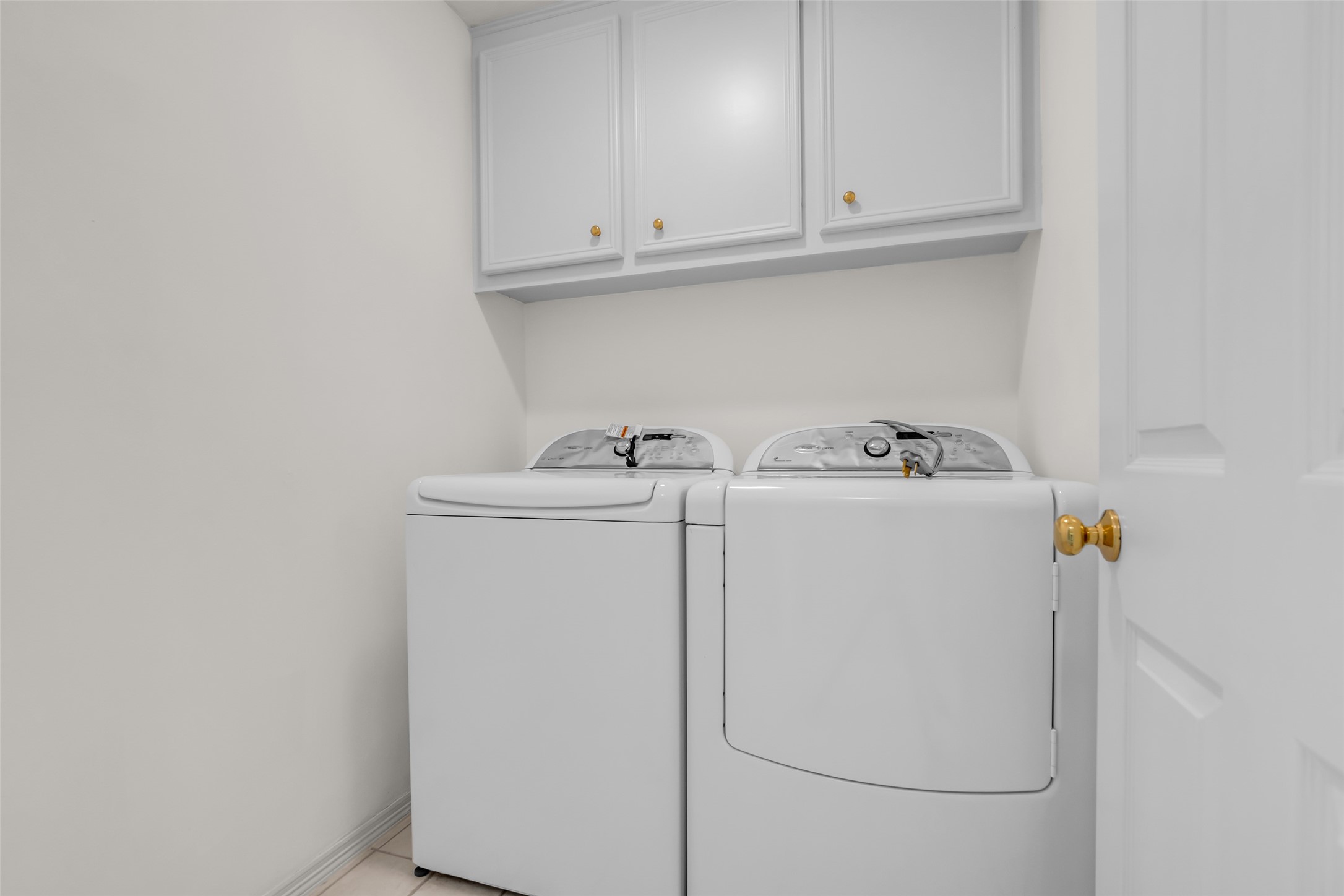 4916 Travis Street Houston, TX 77004 - Photo 22 of 27 a utility room with dryer and washer